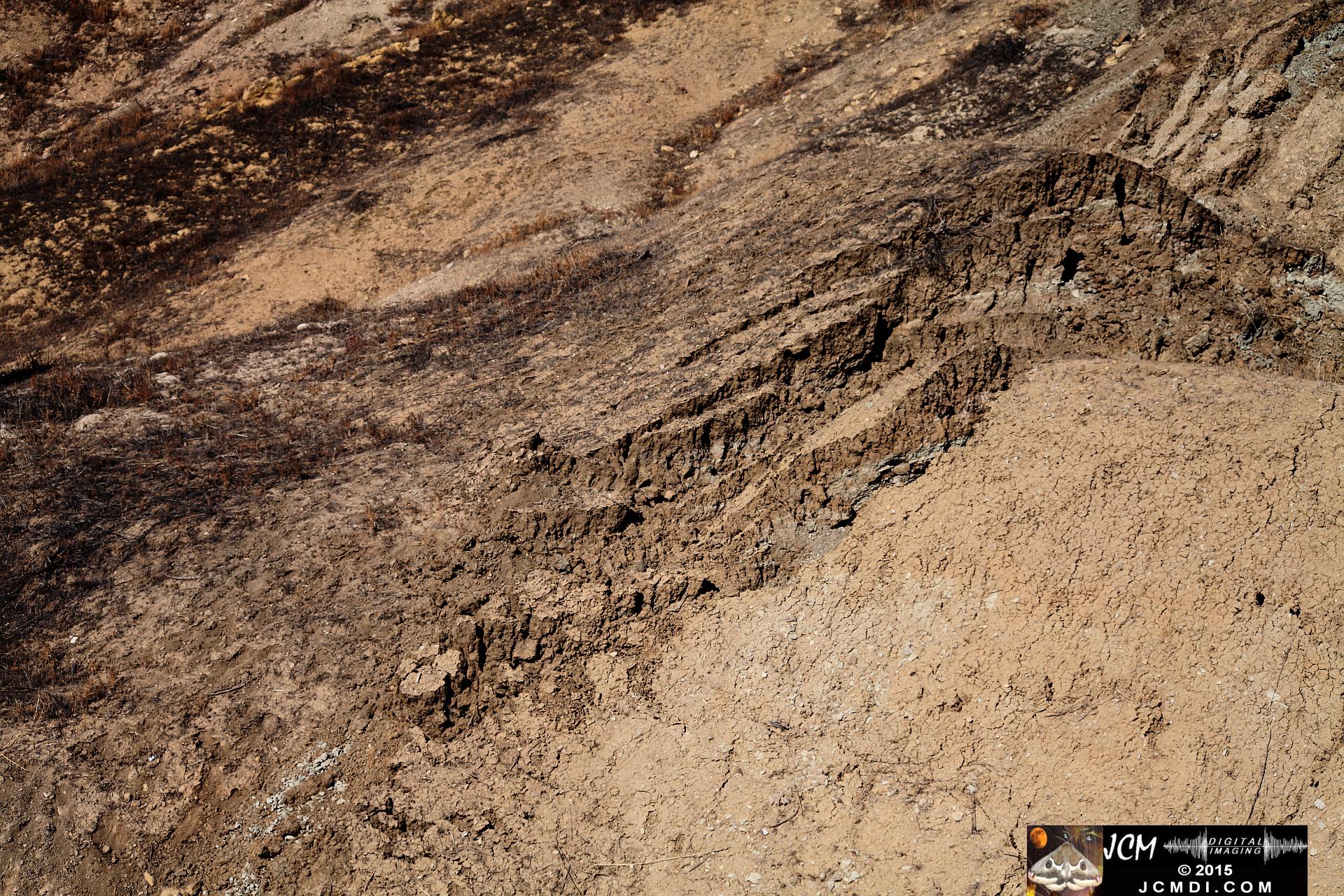 Landslide, buckled pavement, and terrain at Vasquez Canyon Road in Santa Clarita, CA filmed 11-25-2015